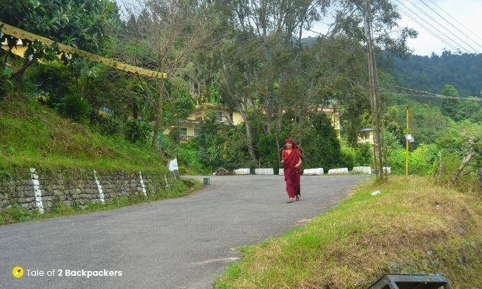 A monk walking on the roads of Gangtok