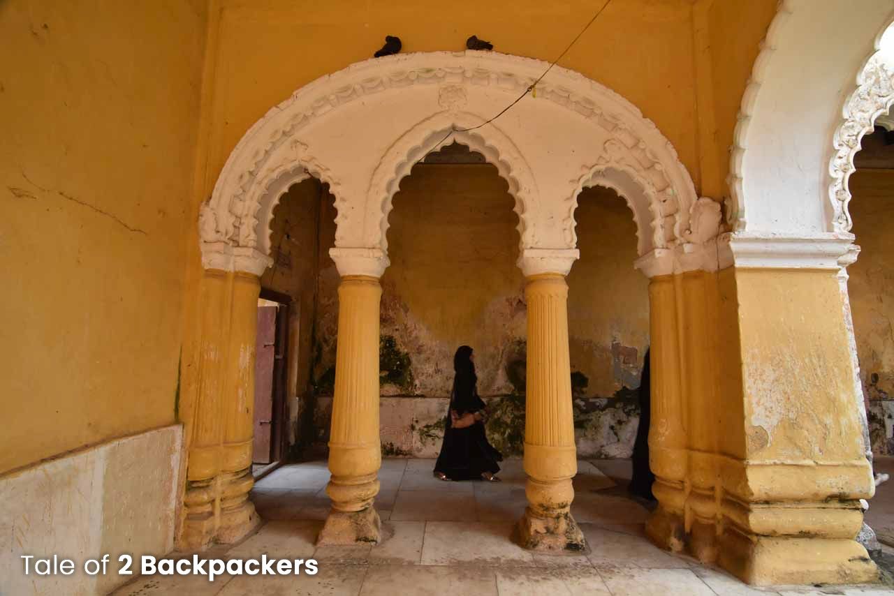 A woman walking inside the Nasipur Palace