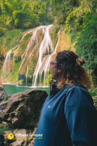 In front of Khaddum Shympe Falls, hidden cave in Meghalaya