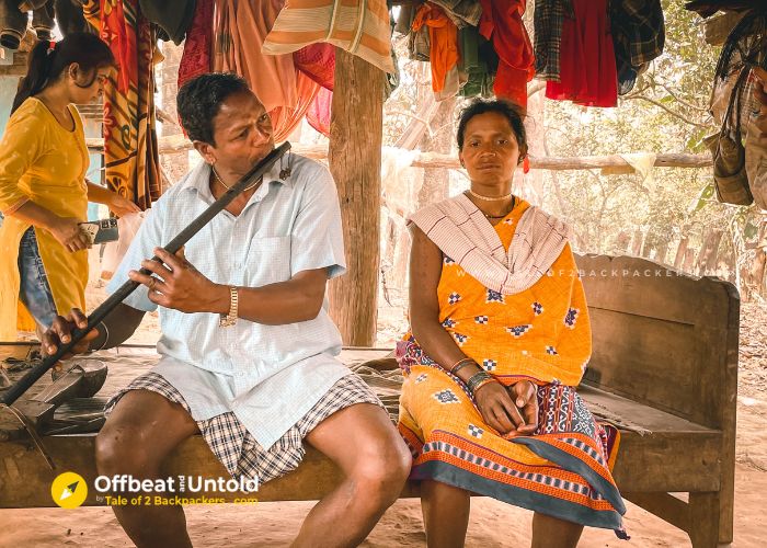 A villager of Bastar playing a musical instreument